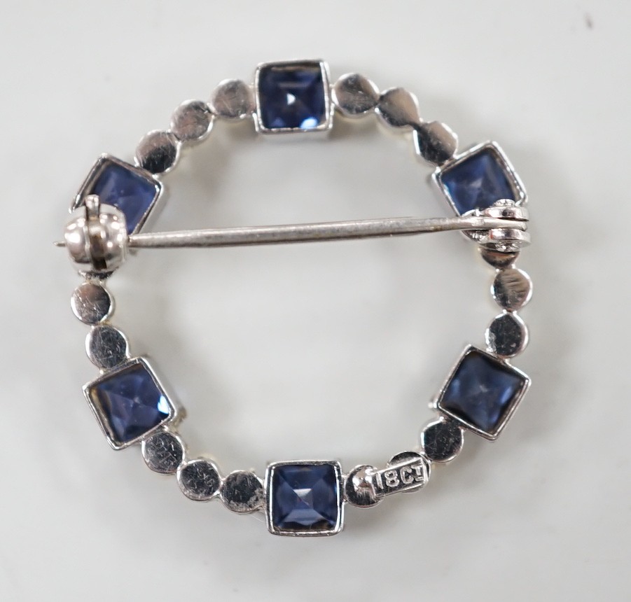 An 18k white metal, synthetic blue spinel? and seed pearl set openwork brooch, 24mm, gross weight 3 grams.
